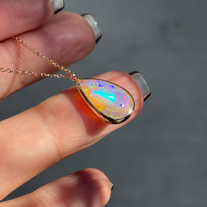 Profile of an Australian Opal Necklace by NIXIN Jewelry showing the bezel setting of the opal.