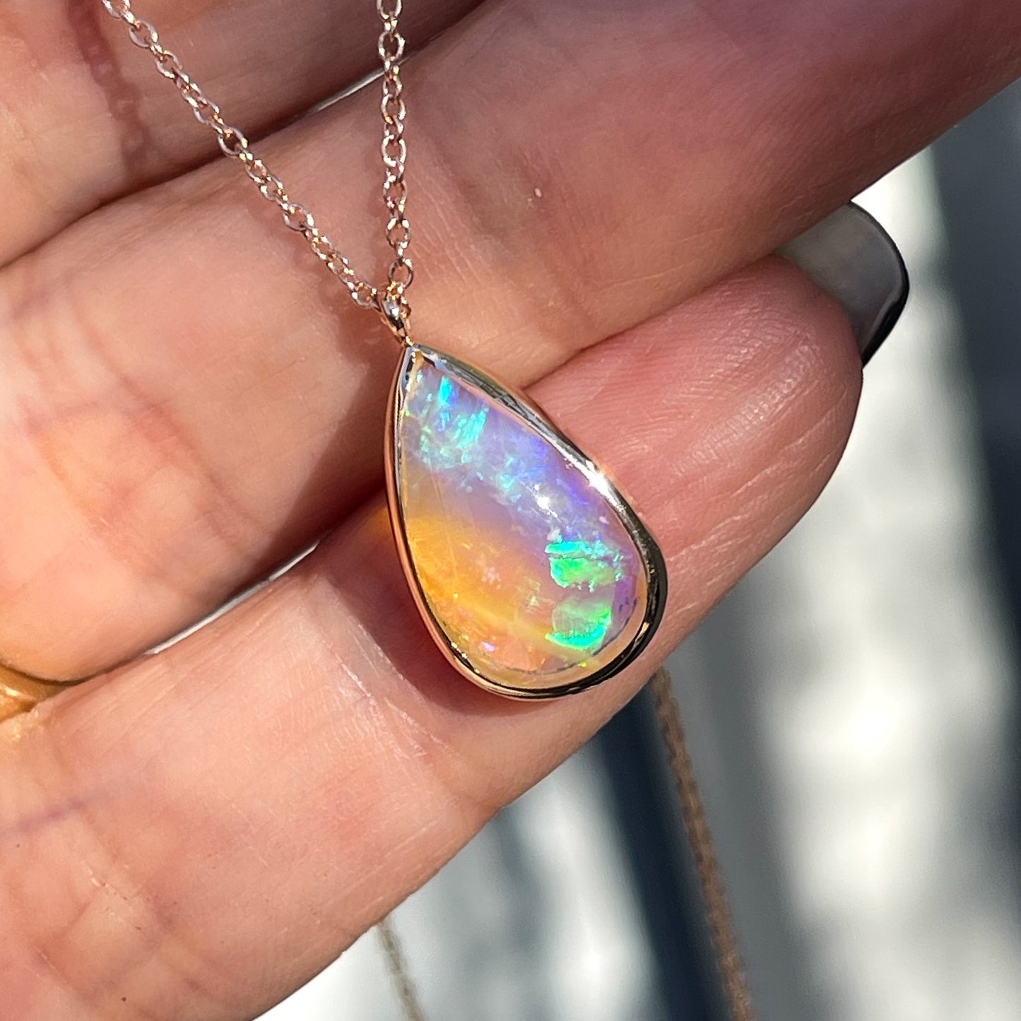 An Australian Opal Necklace by NIXIN Jewelry. An opal pendant set in 14k rose gold.