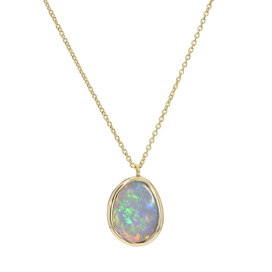 An Australian Opal Necklace by NIXIN Jewelry with an opal pendant set in 14k gold.