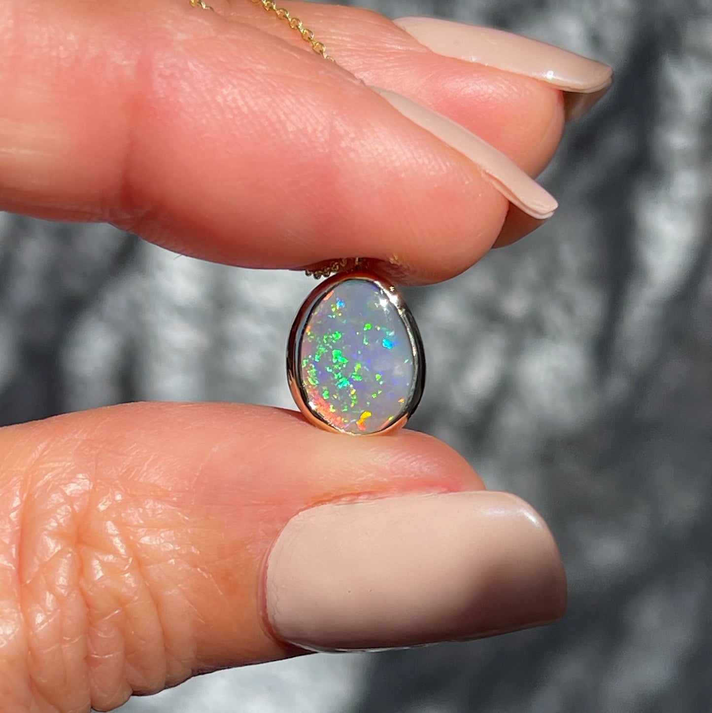 An Australian Opal Necklace by NIXIN Jewelry. An opal pendant necklace with a black opal.