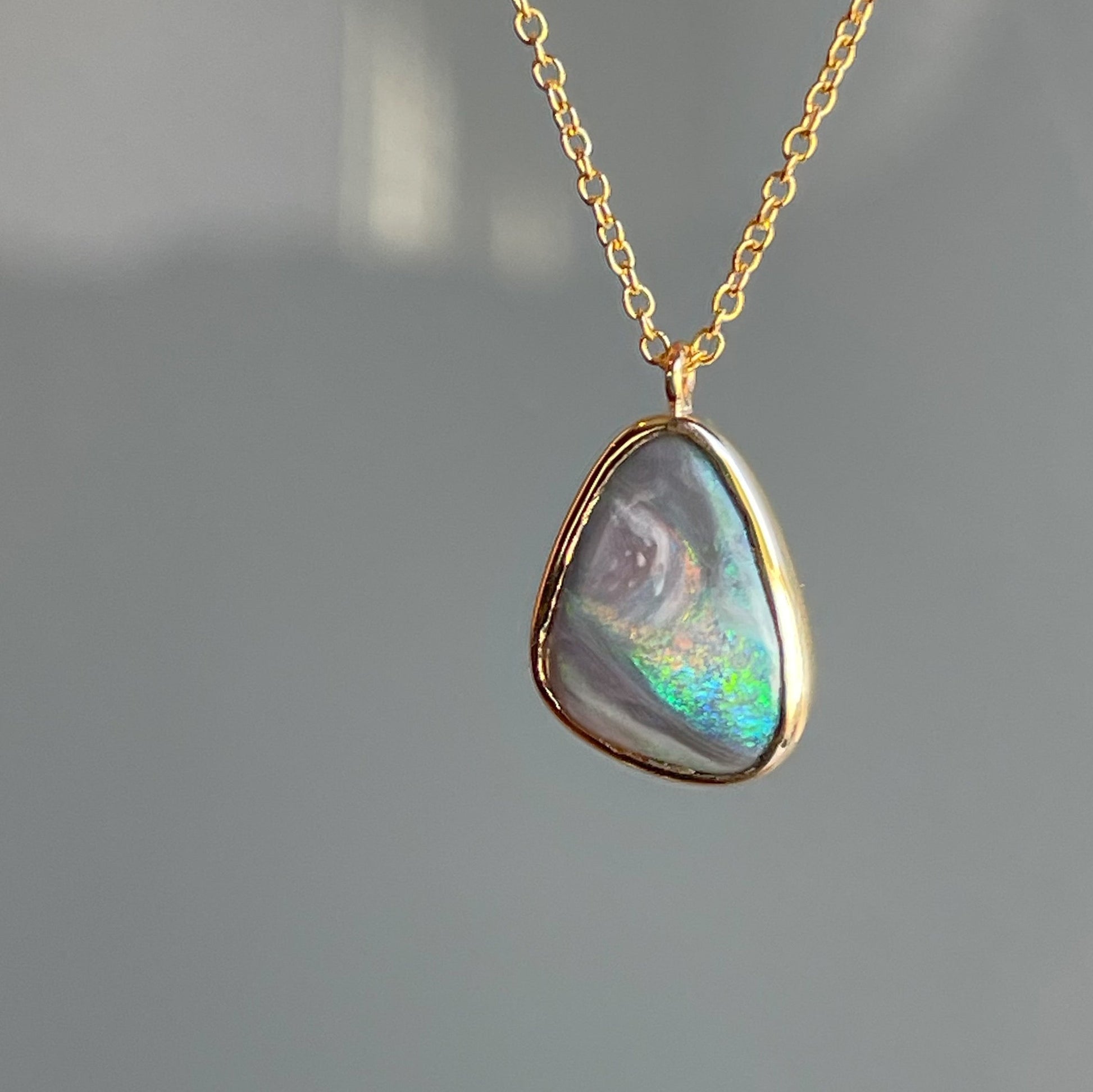 An Australian Opal Necklace by NIXIN Jewelry. A unique opal necklace set in 14k gold.