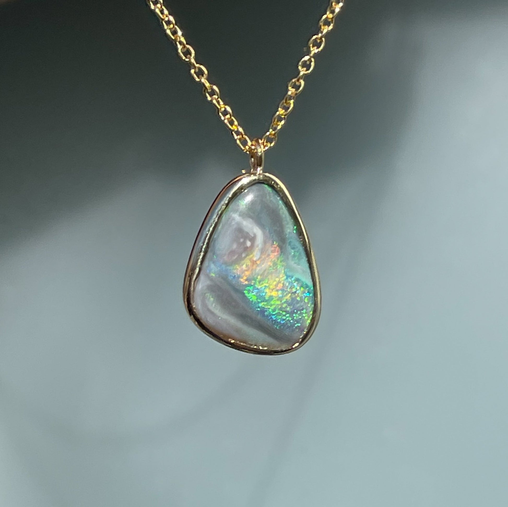 An Australian Opal Necklace by NIXIN Jewelry. A new Opal pendant necklace made with a Black Opal.