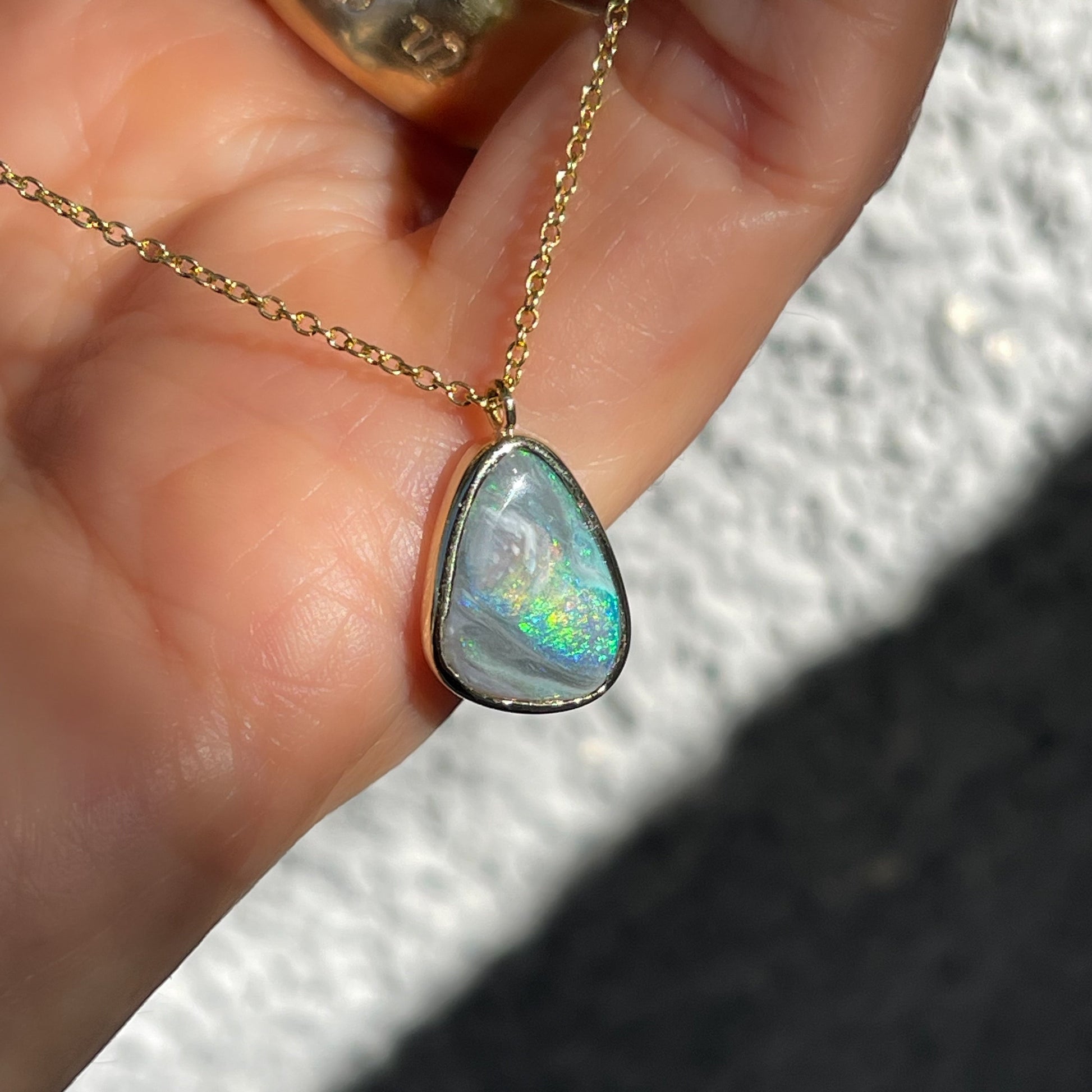 An Australian Opal Necklace by NIXIN Jewelry. A women's luxury necklace made with a Black Opal.