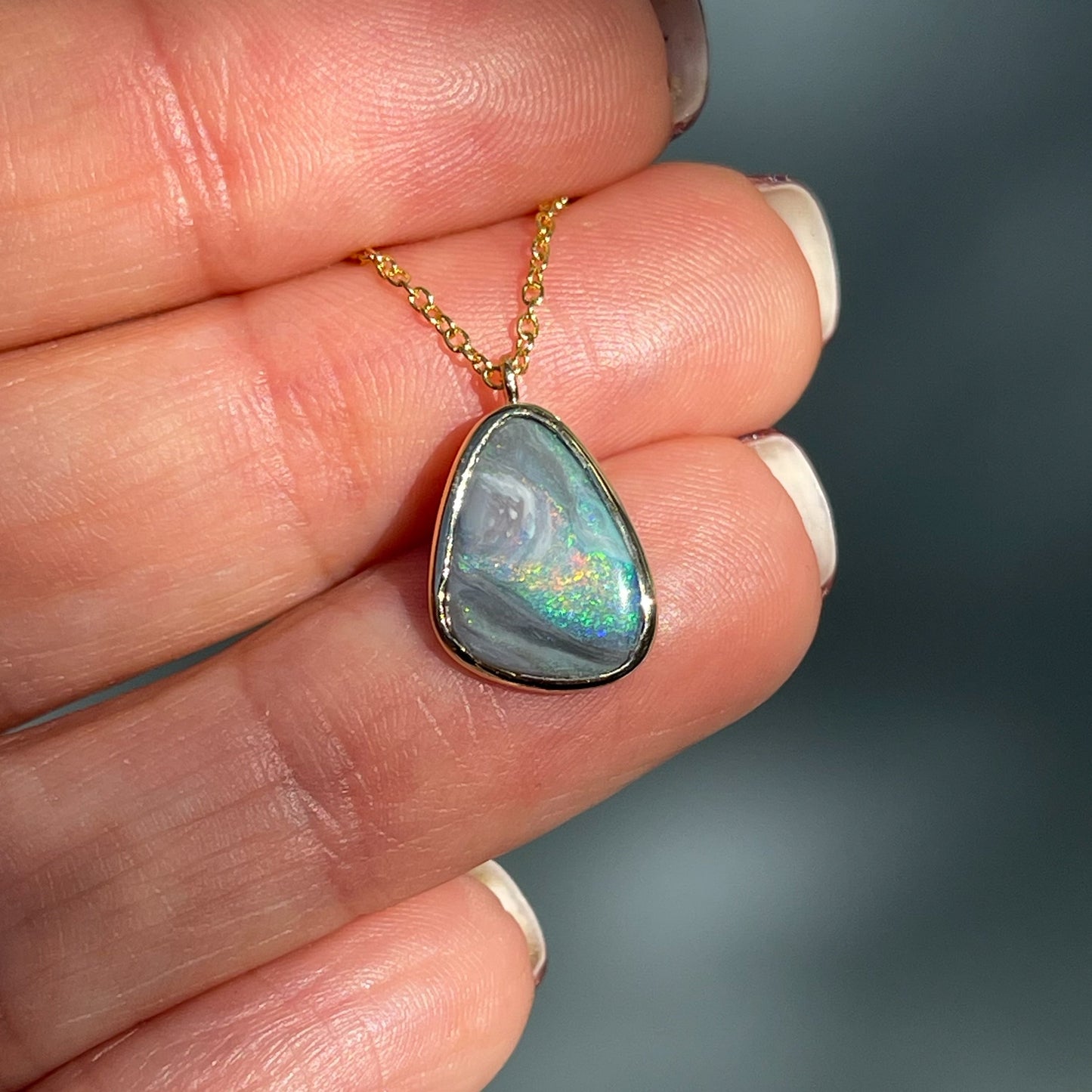 An Australian Opal Necklace by NIXIN Jewelry made with a Black Opal. One of the opal necklaces for sale on NIXINjewelry.com .