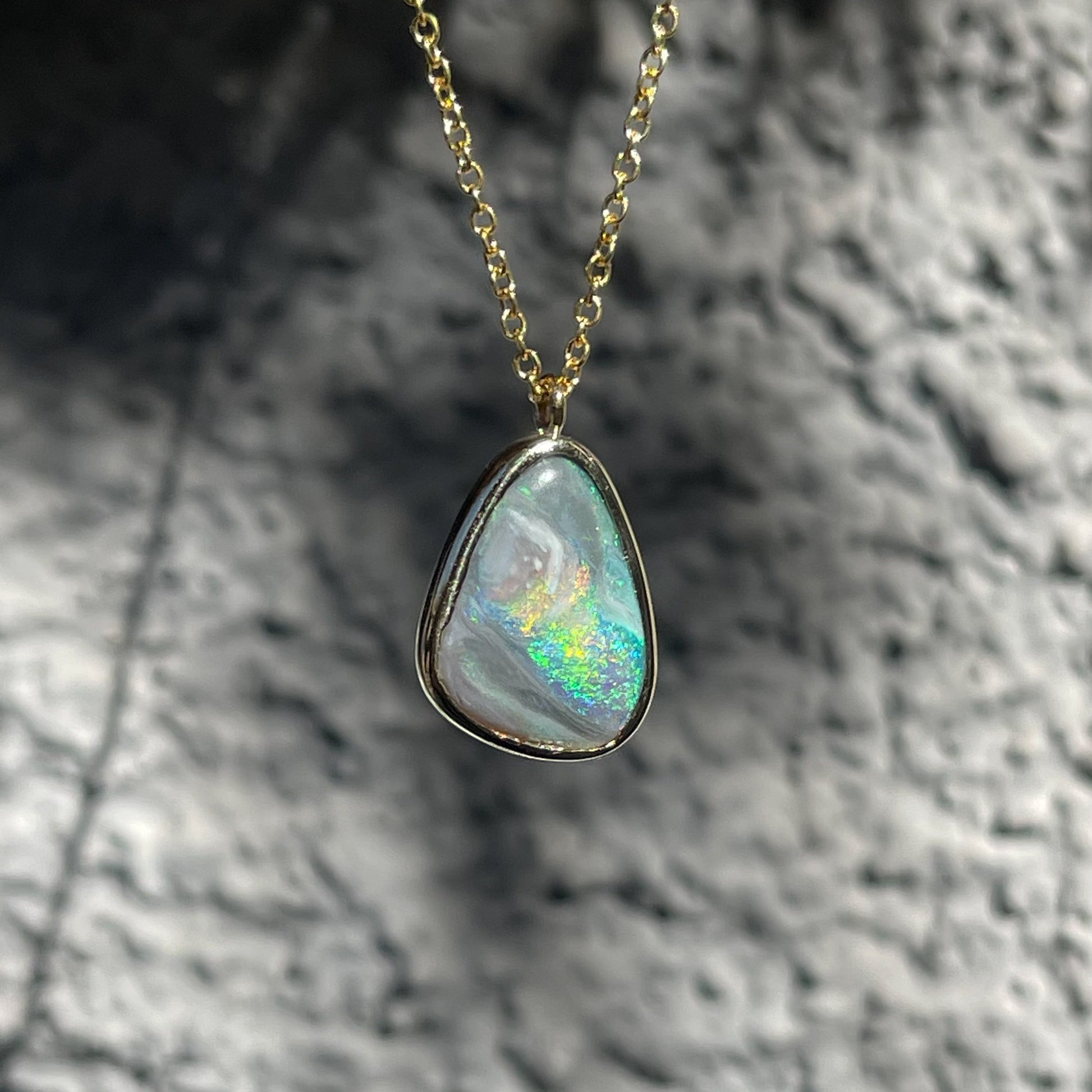 An Australian Opal Necklace by NIXIN Jewelry. A unique opal necklace in a gold bezel setting.