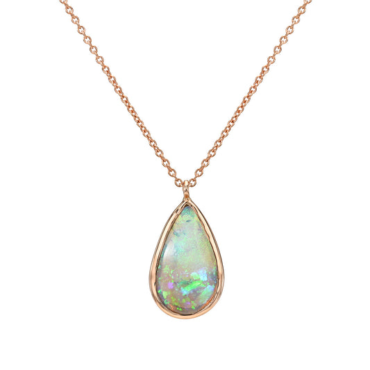 An Australian Opal Necklace by NIXIN Jewelry featuring the Unicorn Tear opal pendant in a clean studio shot. This luxury necklace showcases the green and blue fire of a genuine natural opal in a simple bezel setting. This unique opal necklace is jewelry art for collectors seeking rare opal jewelry.