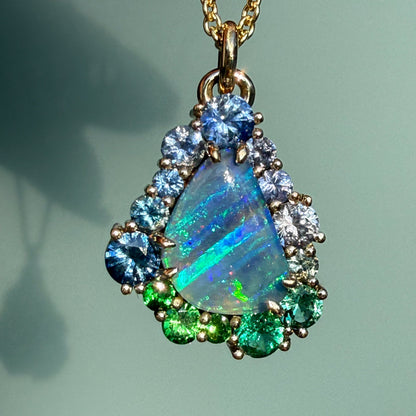 This shot of an Australian Opal Necklace by NIXIN Jewelry captures the intense play-of-color within the central opal pendant. As a piece of rare opal jewelry, it serves as a luxury necklace that stands out for its unique jewelry design.