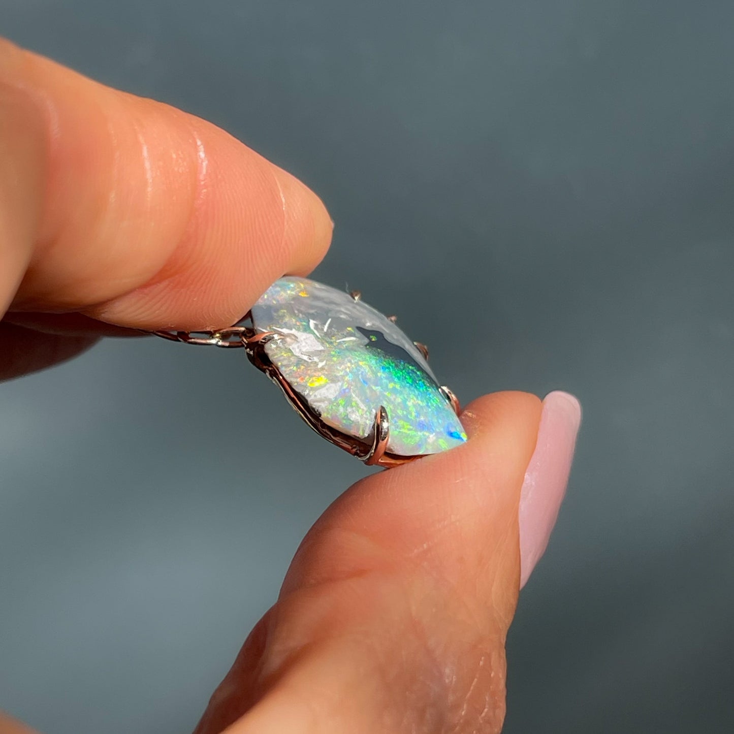 Side view of an Australian Opal Necklace showing prong setting holding the Black Opal.