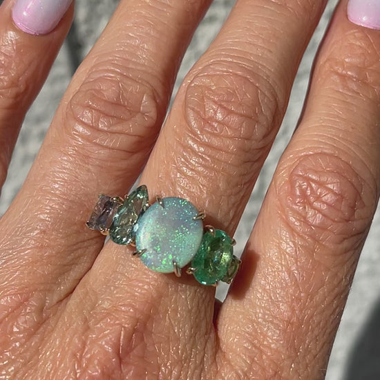 Video of an Australian Opal Ring by NIXIN Jewelry modeled on a hand. NIXIN Jewelry's newest addition to their opal rings for women.