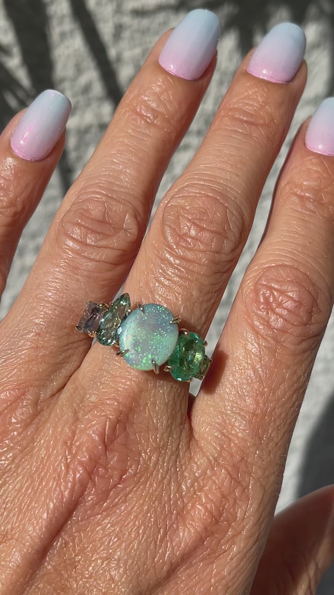 Video of an Australian Opal Ring by NIXIN Jewelry modeled on a hand. NIXIN Jewelry's newest addition to their opal rings for women.