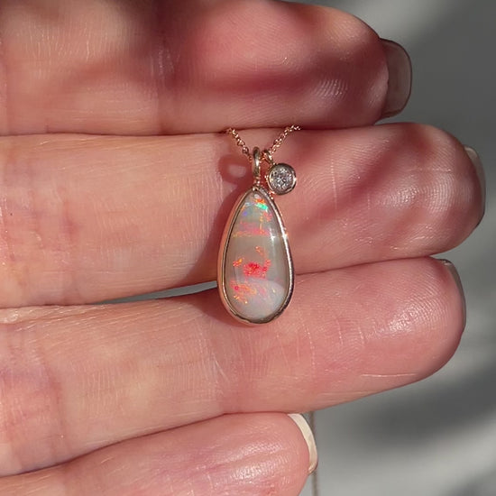 Video of an Australian Opal Necklace by NIXIN Jewelry showing the red flash on the Crystal Opal. A unique opal necklace.