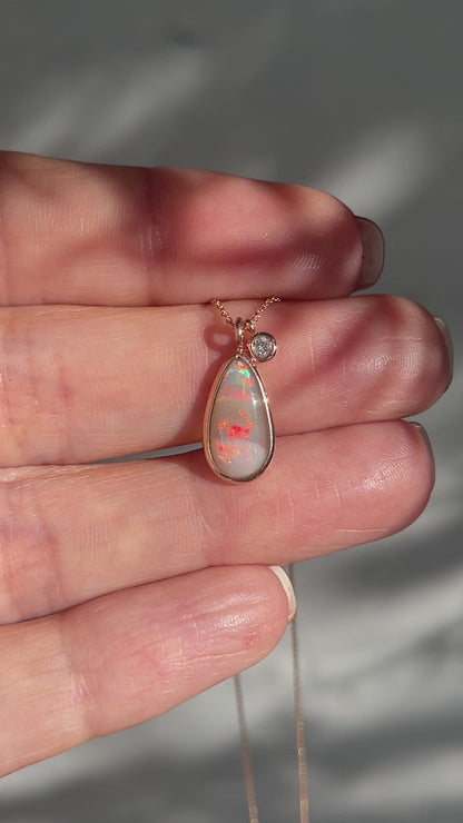 Video of an Australian Opal Necklace by NIXIN Jewelry showing the red flash on the Crystal Opal. A unique opal necklace.