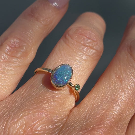 Video of an Australian Opal Ring by NIXIN Jewelry worn on a hand. A black opal ring from our selection of jewelry art.