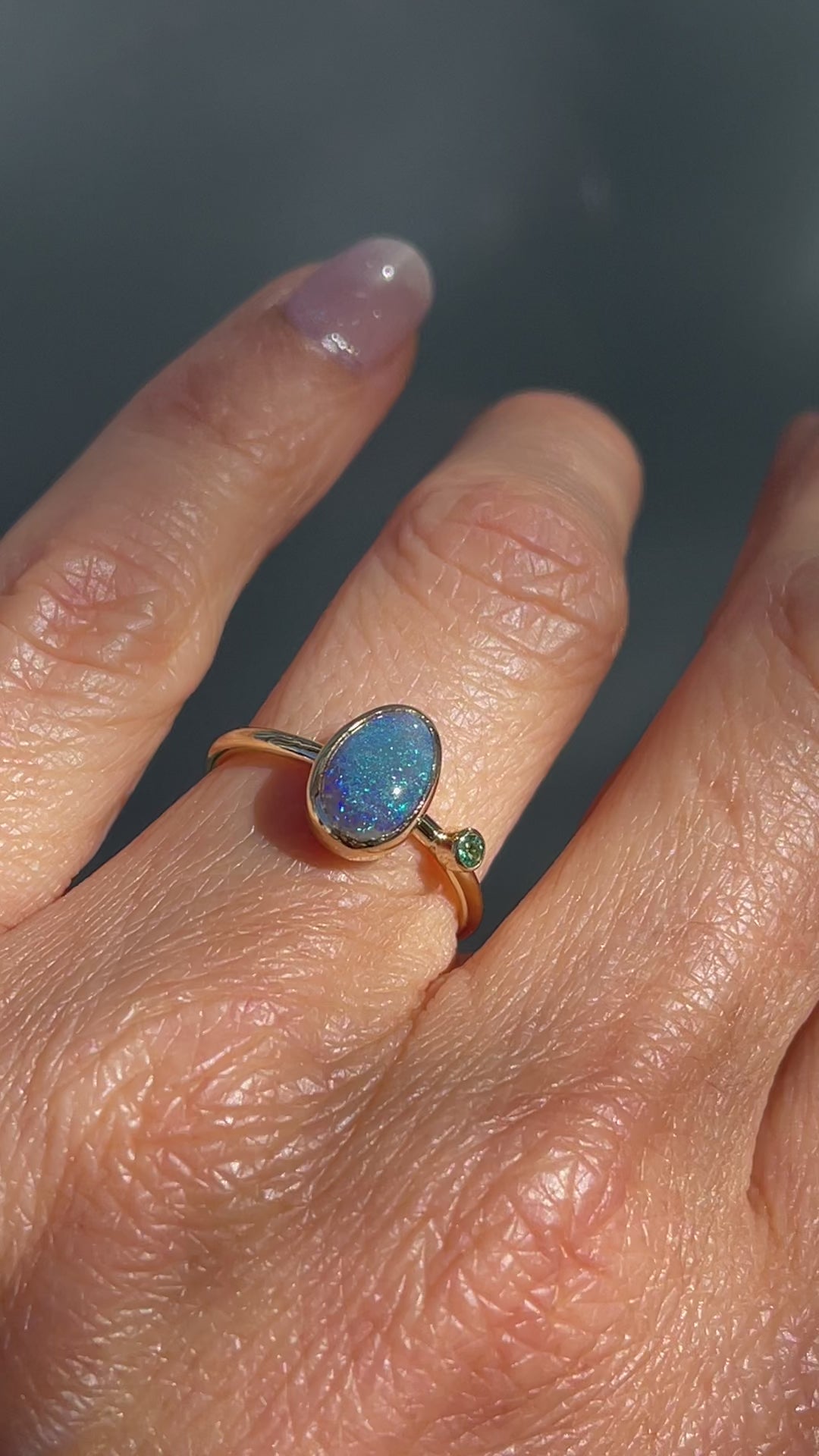 Video of an Australian Opal Ring by NIXIN Jewelry worn on a hand. A black opal ring from our selection of jewelry art.