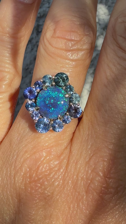 An Australian Opal Ring by NIXIN Jewelry. This video thumbnail shows the full play-of-color and fire of the black opal, confirming its status as a spectacular lightning ridge opal ring. The modern opal ring design classifies this piece as art, suitable for showcasing both luxury and boldness.