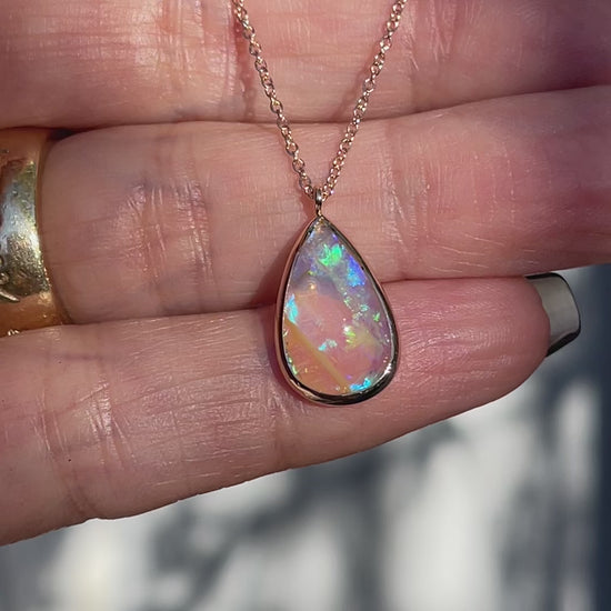 Video of an Australian Opal Necklace by NIXIN Jewelry with a Crystal Opal in a bezel setting.