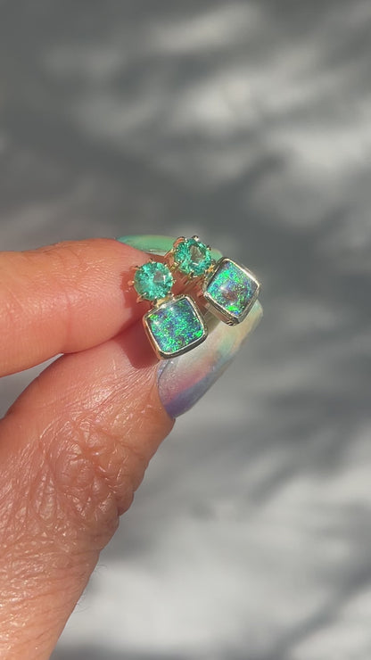 Video of Australian Opal Earrings by NIXIN Jewelry. Shows the vibrant boulder opals and the emeralds in the sunlight.