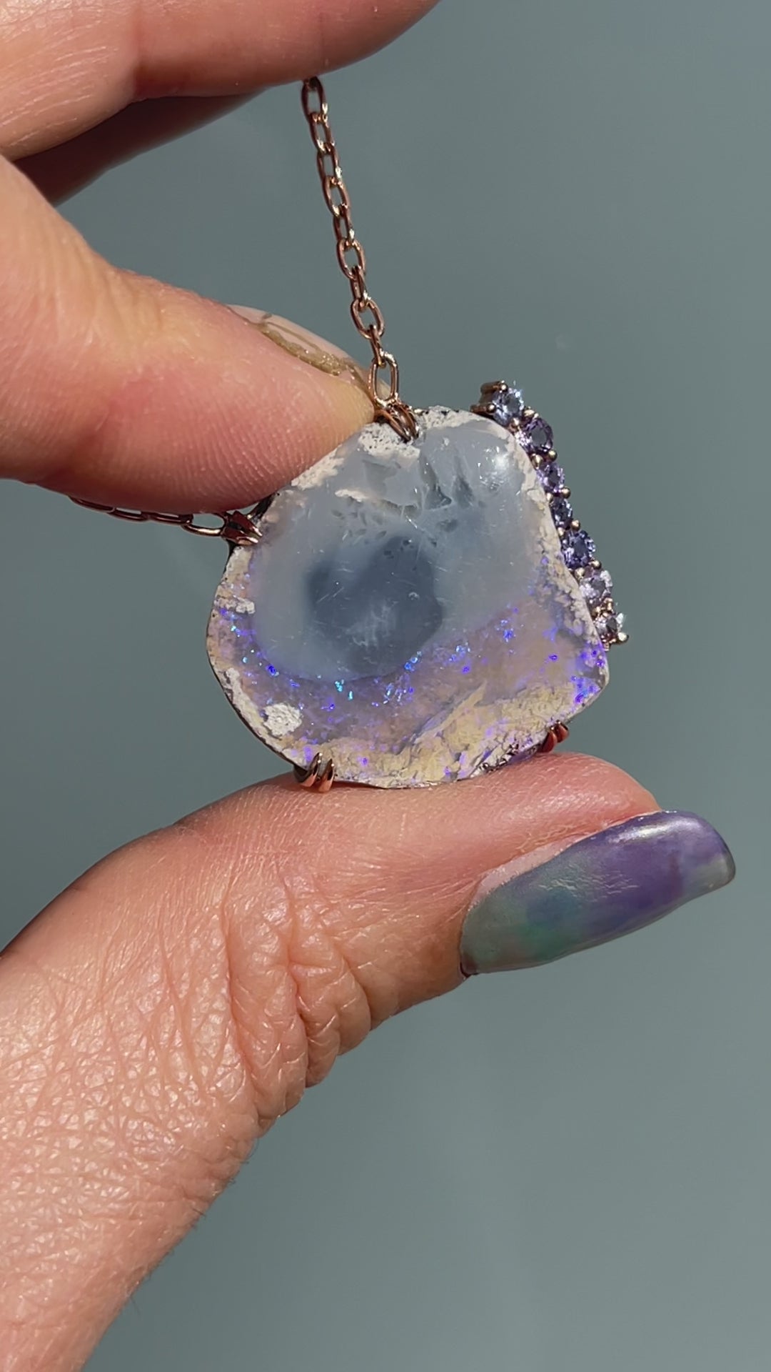 Video of an Australian Opal Necklace by NIXIN Jewelry. An opal and sapphire necklace.