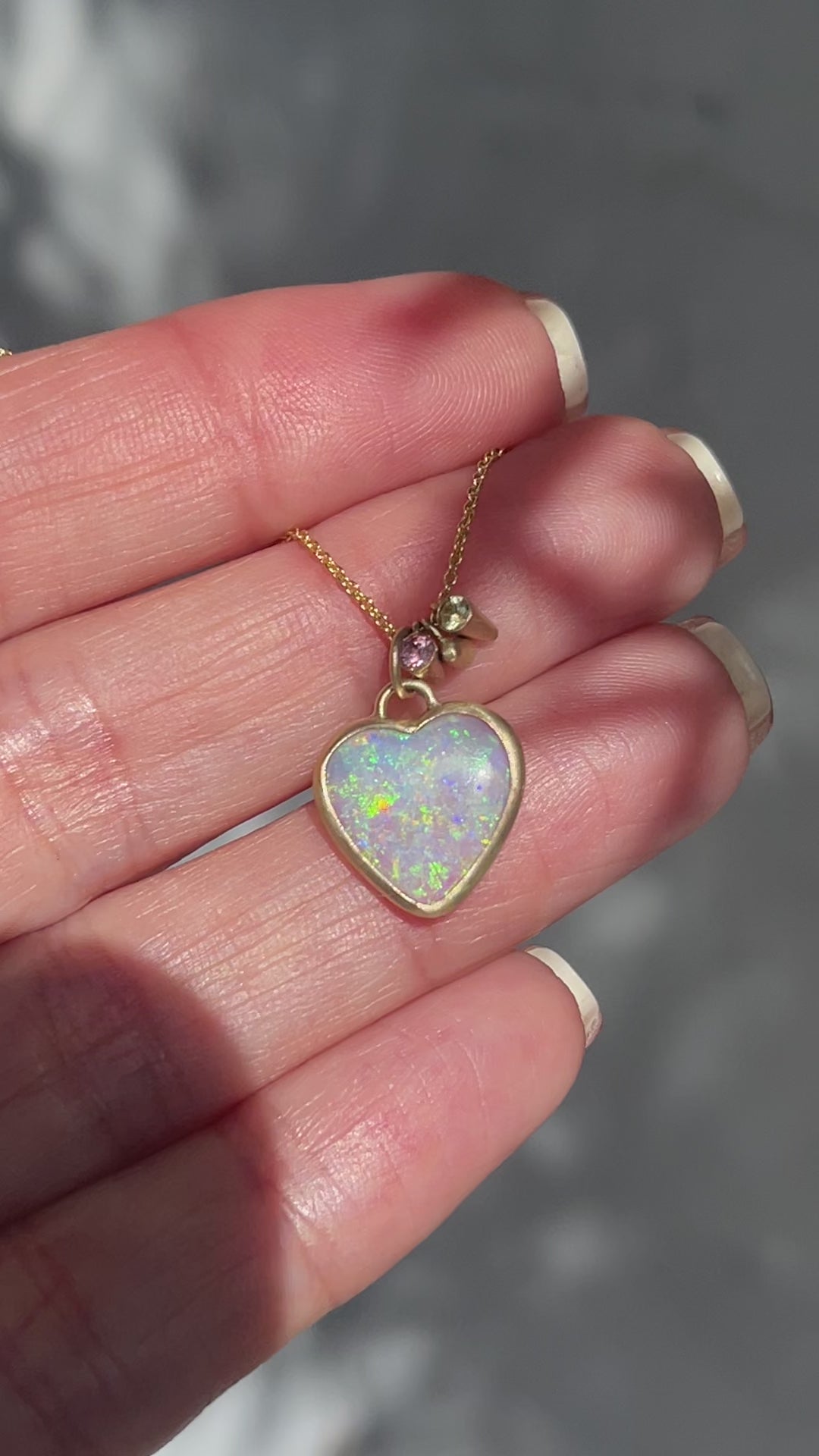 Video of an Australian Opal Necklace by NIXIN Jewelry showing both sides of the opal pendant.