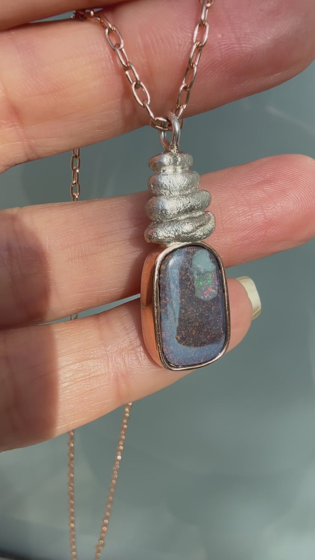 This video captures the dynamic movement and shifting sparks of fire in an Australian Opal Necklace by NIXIN Jewelry. Watch as the rare opal necklace flickers with unexpected pinks and greens, demonstrating the life within the boulder opal. This luxury necklace video brings the unique opal jewelry to life for the discerning buyer.