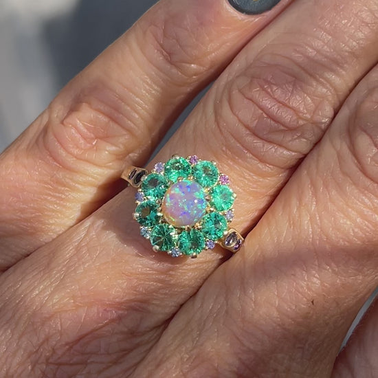 Video of an Australian Opal Ring by NIXIN Jewelry modeled on a hand. The crystal opal ring is rare fine jewelry.