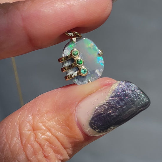 Video of an Australian Opal Necklace by NIXIN Jewelry. Shows the green flash of the opal pendant necklace. 
