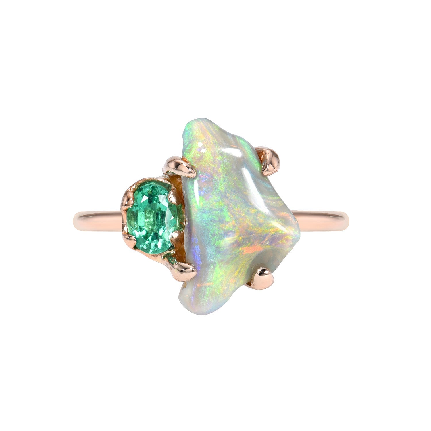 An Opal and Emerald Ring by NIXIN Jewelry shown against a white background. One of a kind Black Opal Ring.