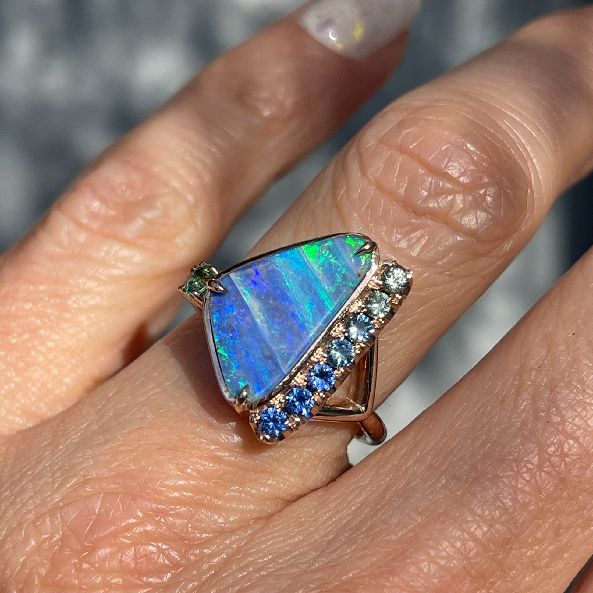 An Australian Opal Ring by NIXIN Jewelry. The Boulder Opal ring is set in rose gold.