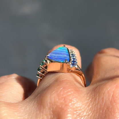 An Australian Opal Ring by NIXIN Jewelry shown low in profile on a finger.
