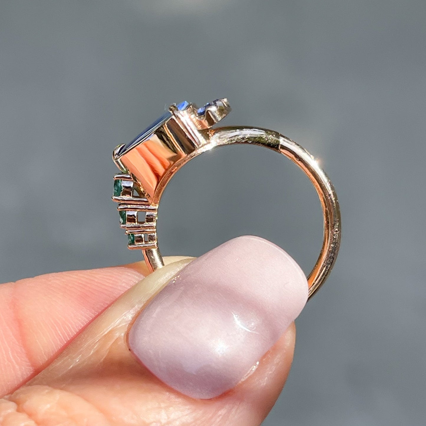 Profile shot of an Australian Opal Ring by NIXIN Jewelry. A rose gold opal ring.