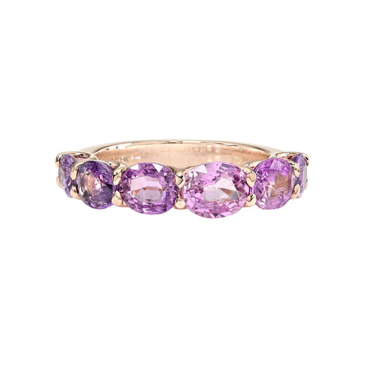 A Sapphire Ring by NIXIN Jewelry featuring oval-cut pink and purple sapphires in a rose gold band. This unique fine jewelry piece is set in a secure prong setting.
