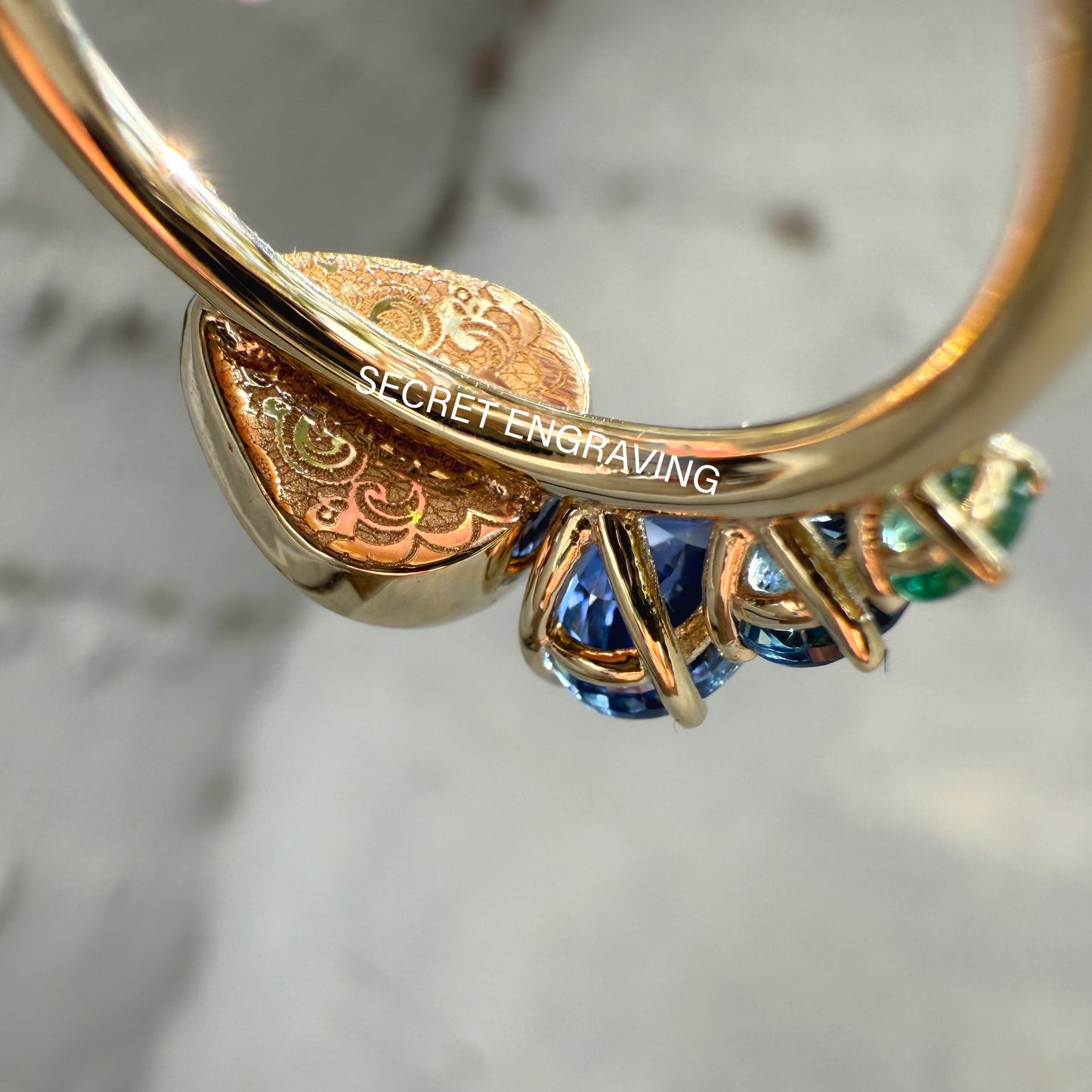 An Australian Opal Ring by NIXIN Jewelry. This close-up shot of the black opal jewelry piece highlights the flawless craftsmanship and the vibrant, firey colors of the natural opal.