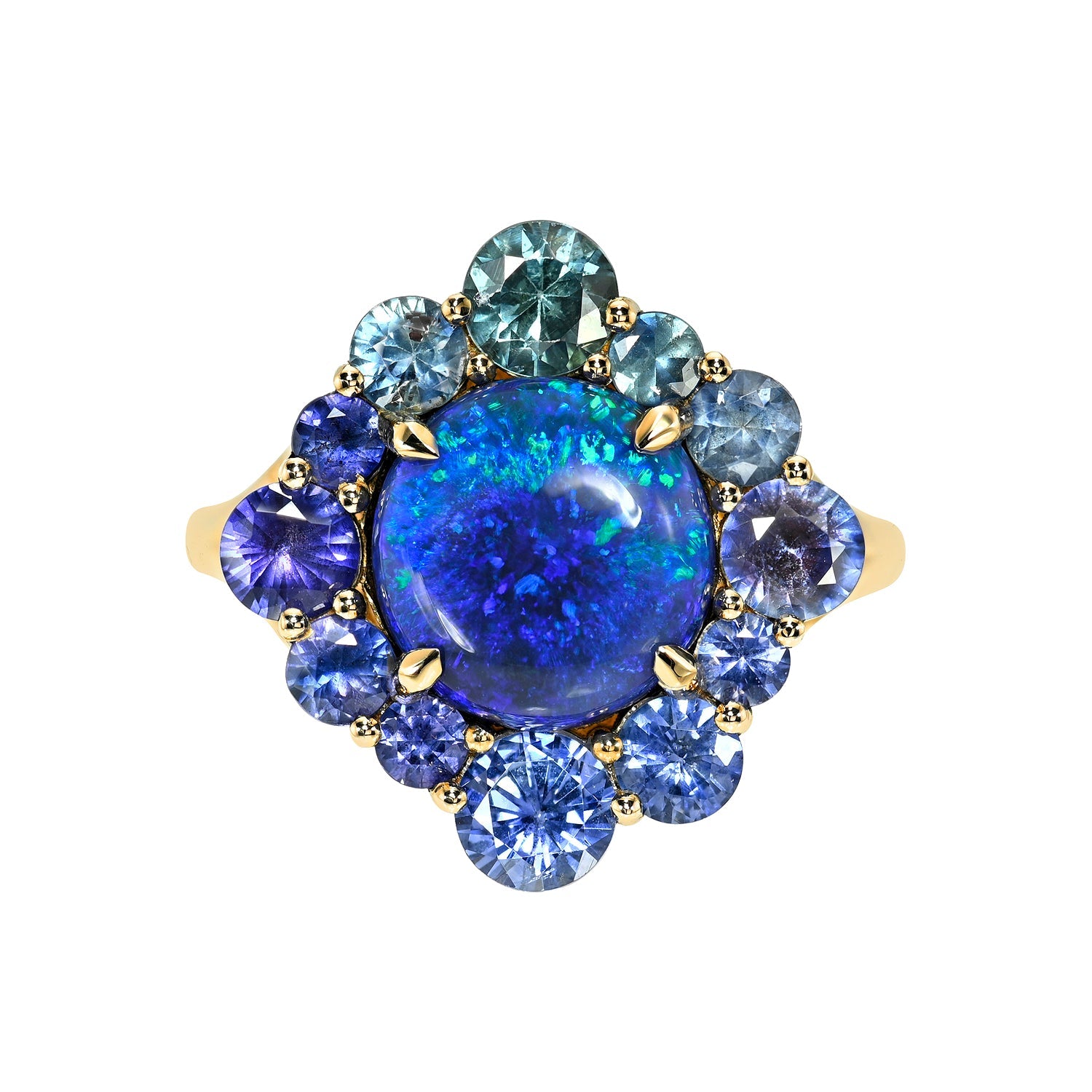 An Australian Opal Ring by NIXIN Jewelry. This rare opal ring features a round lightning ridge opal in a prong setting, surrounded by an ombre halo of blue, teal, and violet sapphires. This unique opal jewelry piece is crafted in 14k gold, showcasing exceptional jewelry art and luxury jewelry.