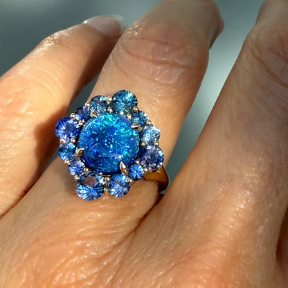 An Australian Opal Ring by NIXIN Jewelry. This side view highlights the meticulous 14k gold opal ring craftsmanship and the substantial setting of the australian opal. The black opal ring is a bold, modern opal ring that showcases the depth of the natural opal.