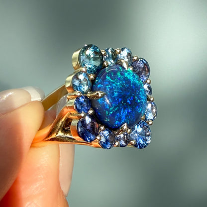 An Australian Opal Ring by NIXIN Jewelry. This luxury piece features a magnificent australian opal set in a dimensional 14k gold structure, confirming its status as a high-quality, unique jewelry creation. It is a highly sought-after modern opal ring and an exquisite example of rare jewelry craftsmanship.