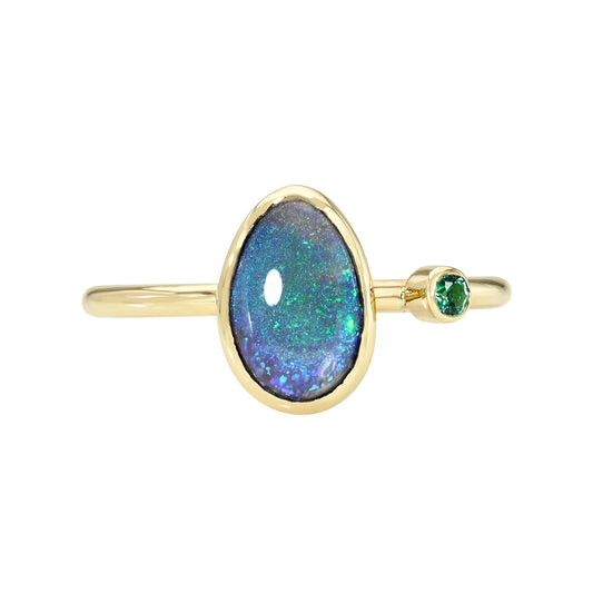 An Australian Opal Ring by NIXIN Jewelry with a black opal and an emerald.