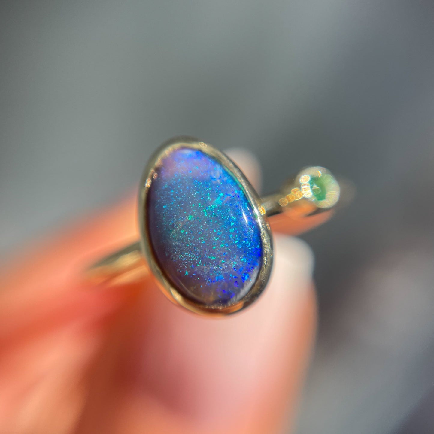 Close up of an Australian Opal Ring by NIXIN Jewelry. Features the black opal in the unique opal ring.