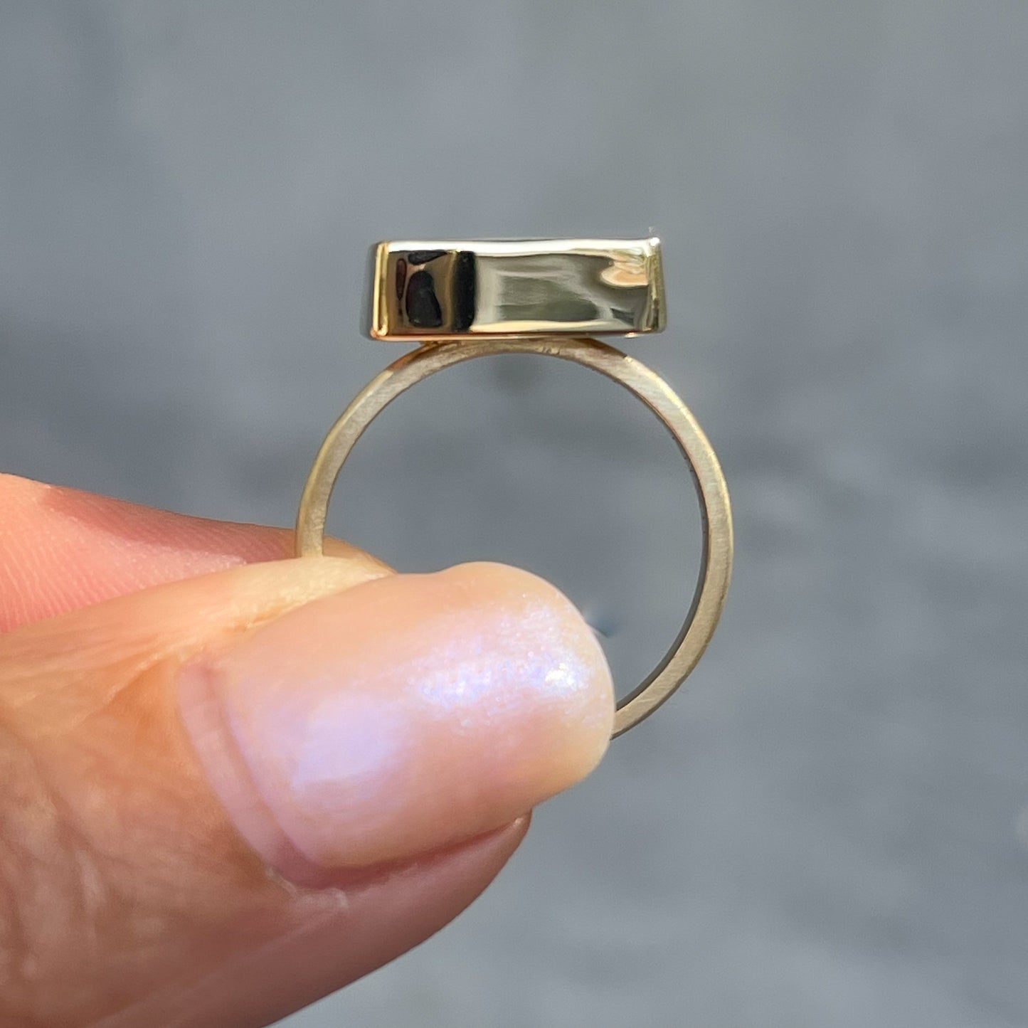 Profile view of an Australian Opal Ring by NIXIN Jewelry set in 14k gold.