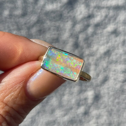 An Australian Opal Ring by NIXIN Jewelry made in 14k gold with an opal stone.
