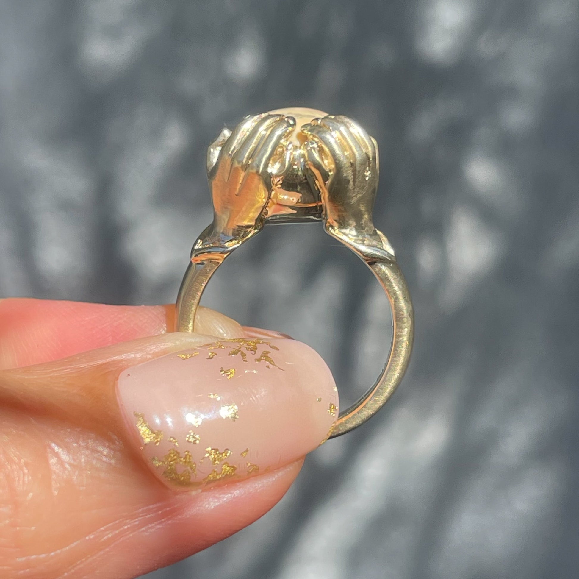 Profile of an Australian Opal Ring by NIXIN Jewelry. The gold opal ring is jewelry art.