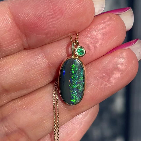 Video of Australian opal necklace with black opal and emerald by NIXIN Jewelry