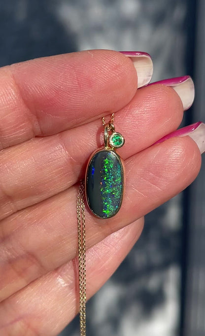 Video of Australian opal necklace with black opal and emerald by NIXIN Jewelry