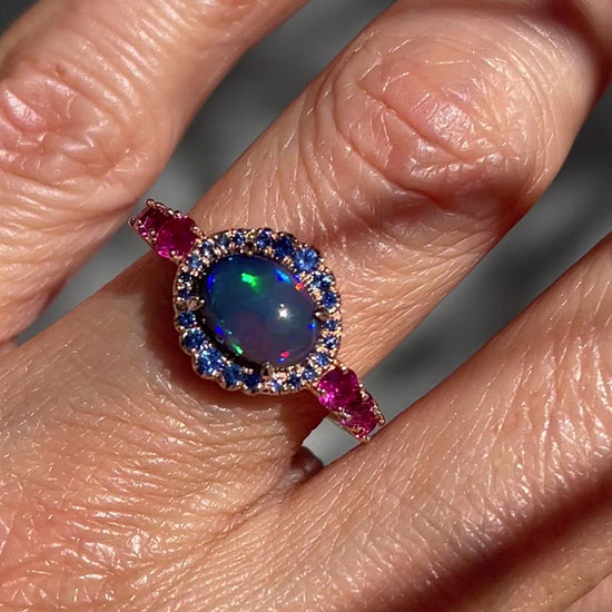 Video of Sapphire and Opal Ring by NIXIN Jewelry on hand. Natural Australian opal ring.