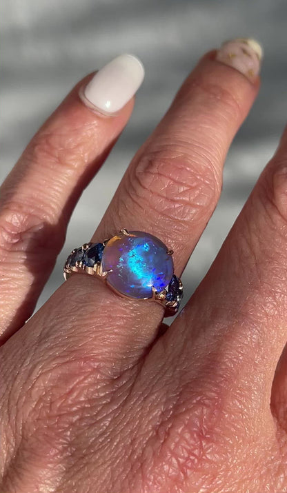 Video of black opal ring in 14k rose gold by NIXIN Jewelry on model's hand