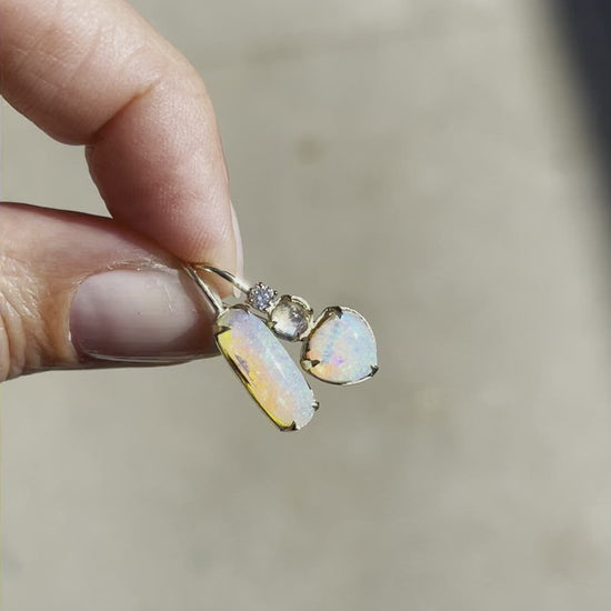Video of asymmetrical earrings with blue moonstone and crystal opal by NIXIN Jewelry