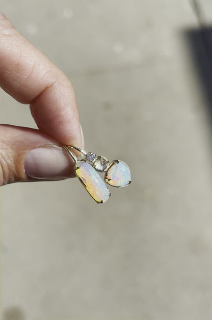 Video of asymmetrical earrings with blue moonstone and crystal opal by NIXIN Jewelry