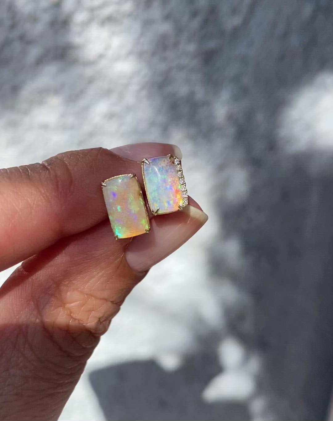 Video of asymmetrical opal stud earrings by NIXIN Jewelry