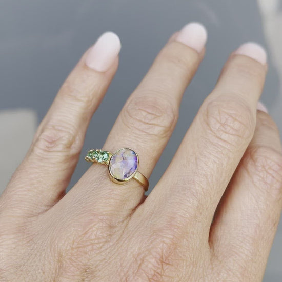 Video of Waimea Canyon emerald and opal ring by NIXIN Jewelry on hand