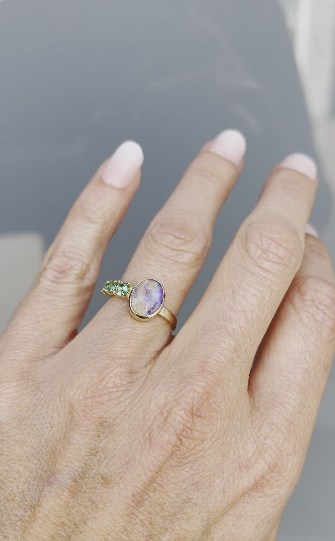 Video of Waimea Canyon emerald and opal ring by NIXIN Jewelry on hand