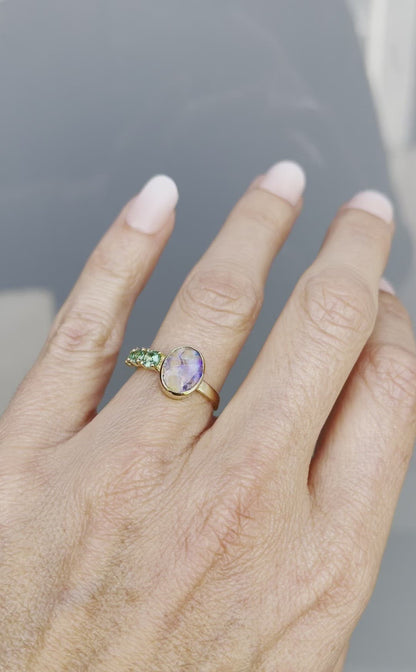 Video of Waimea Canyon emerald and opal ring by NIXIN Jewelry on hand